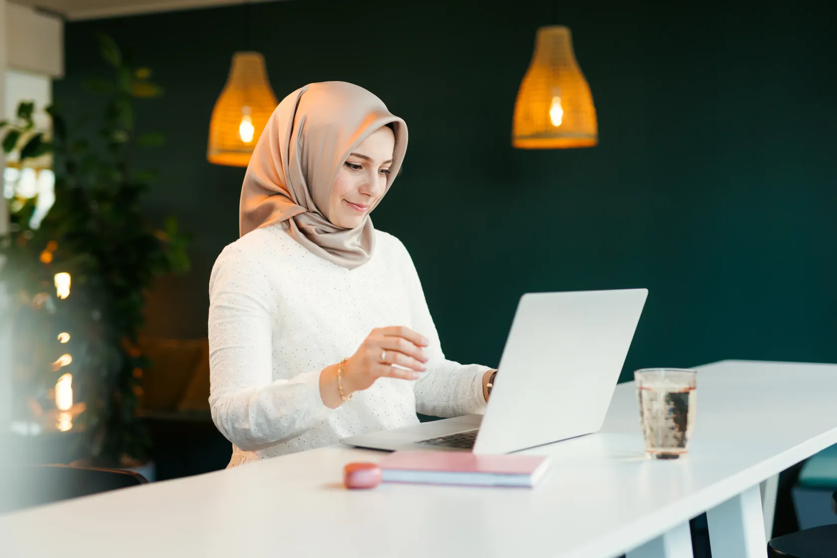 Female colleague working on a notebook