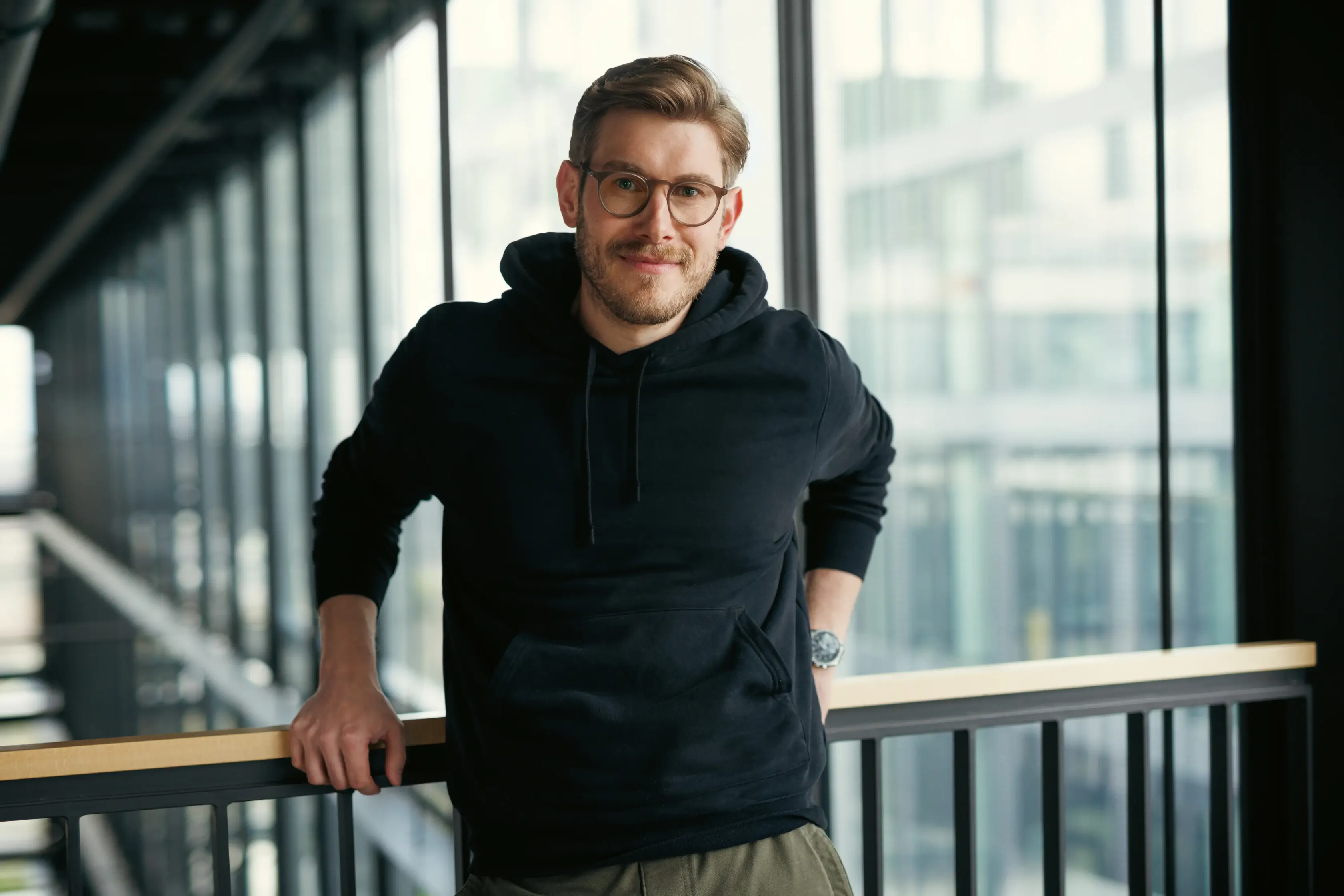 Portrait of male colleague in black sweater