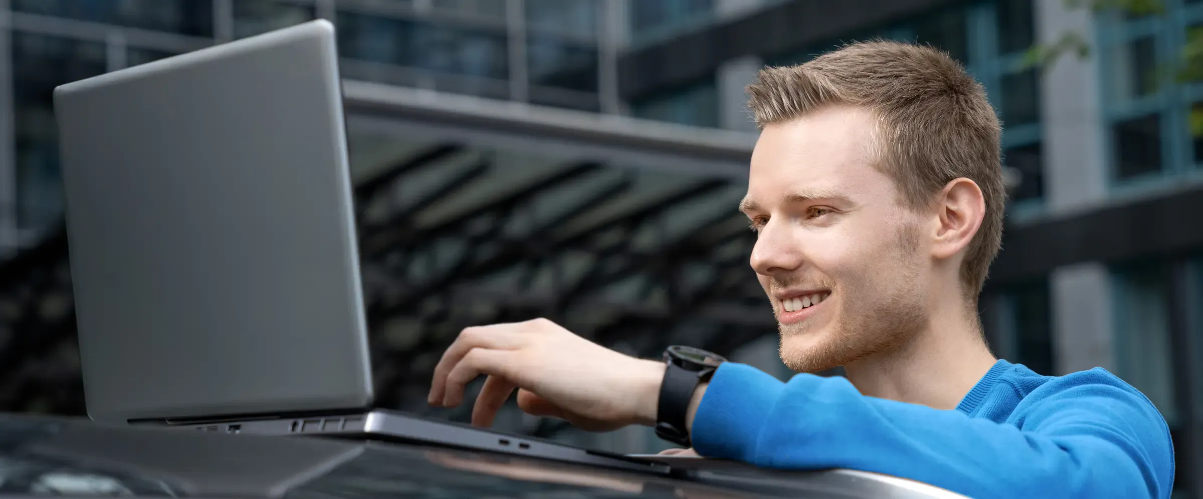 A person presenting the technical structure of a car
